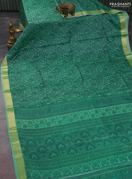 Printed silk saree pastel green with allover prints and zari woven border