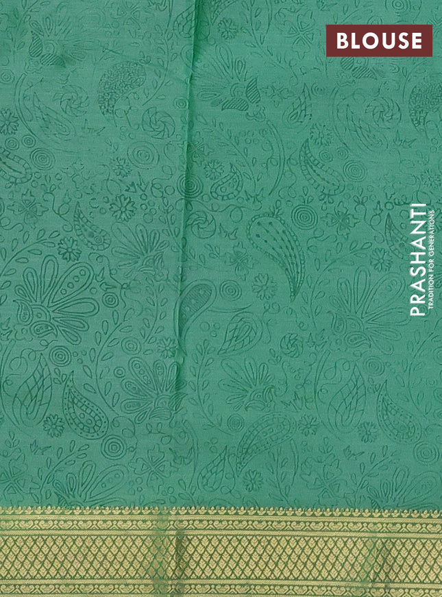 Printed silk saree pastel green with allover prints and zari woven border