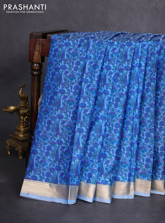 Printed silk saree blue shade with allover prints and zari woven border