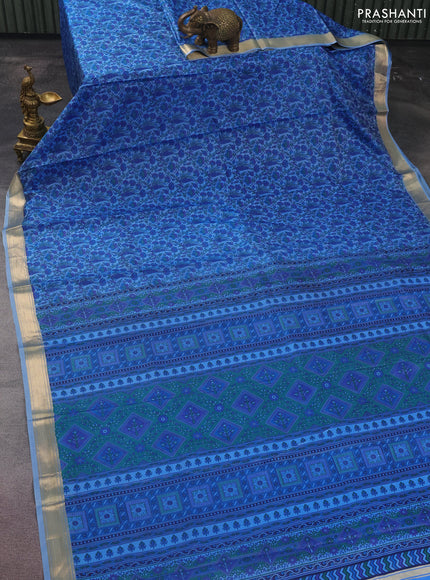 Printed silk saree blue shade with allover prints and zari woven border