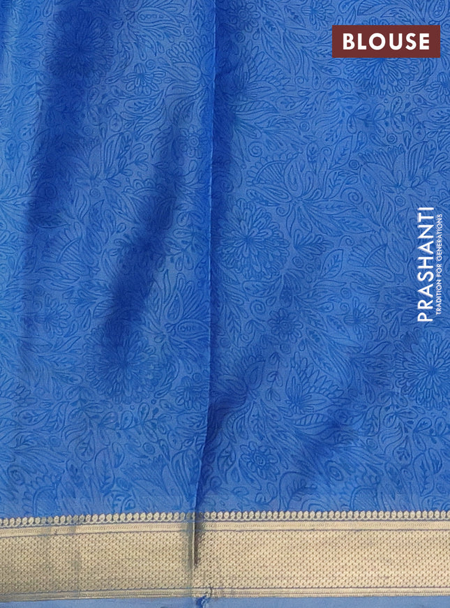 Printed silk saree blue shade with allover prints and zari woven border
