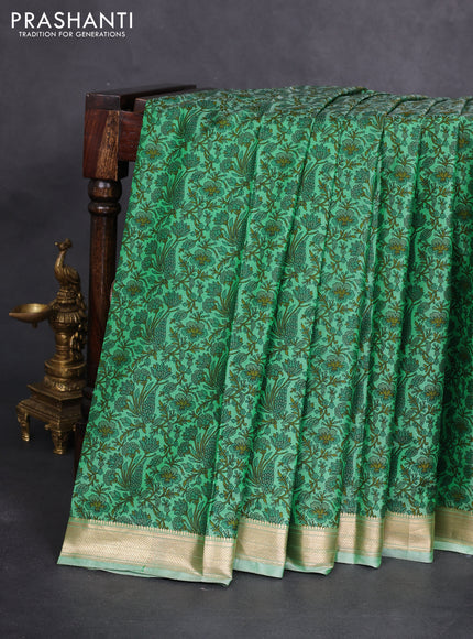 Printed silk saree pastel green with allover prints and zari woven border