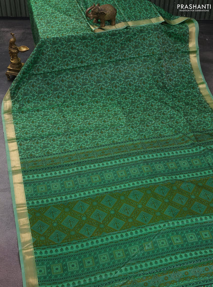 Printed silk saree pastel green with allover prints and zari woven border