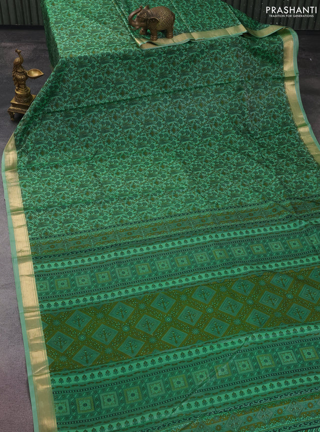 Printed silk saree pastel green with allover prints and zari woven border