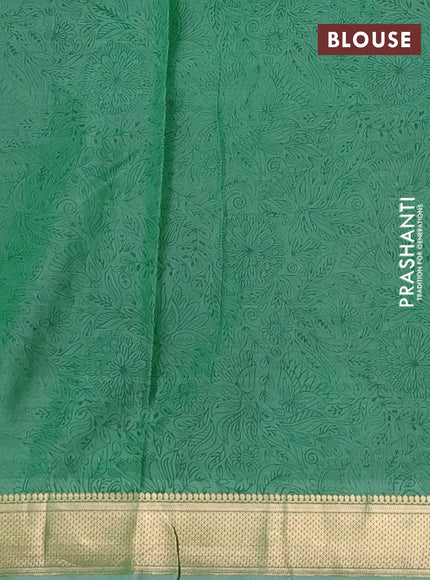 Printed silk saree pastel green with allover prints and zari woven border