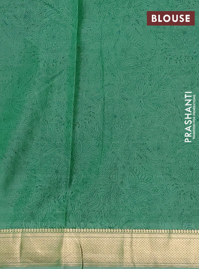 Printed silk saree pastel green with allover prints and zari woven border