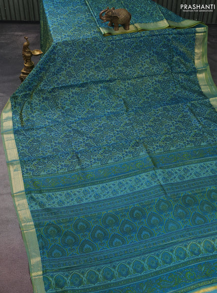 Printed silk saree dual shade of green with allover prints and zari woven border