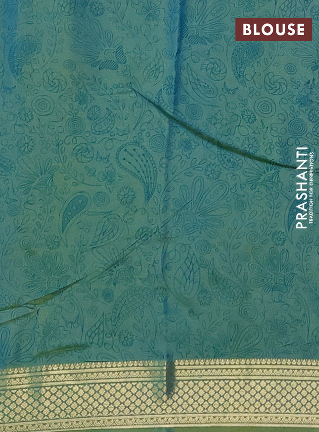 Printed silk saree dual shade of green with allover prints and zari woven border