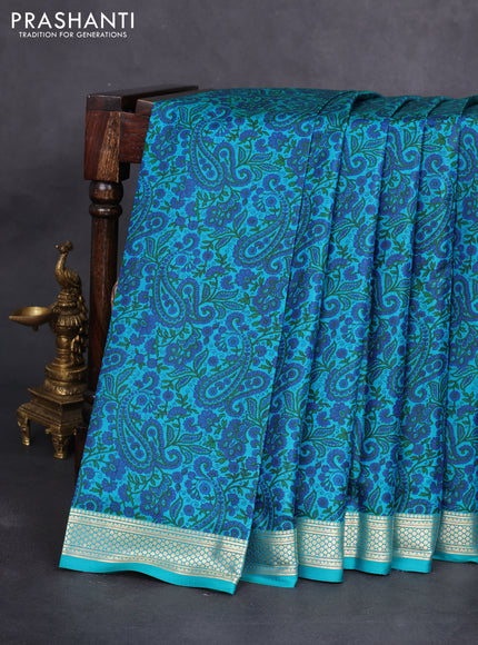Printed silk saree teal green with allover prints and zari woven border