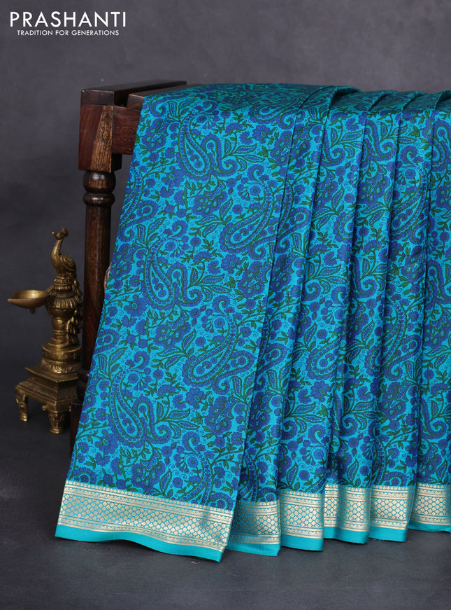 Printed silk saree teal green with allover prints and zari woven border
