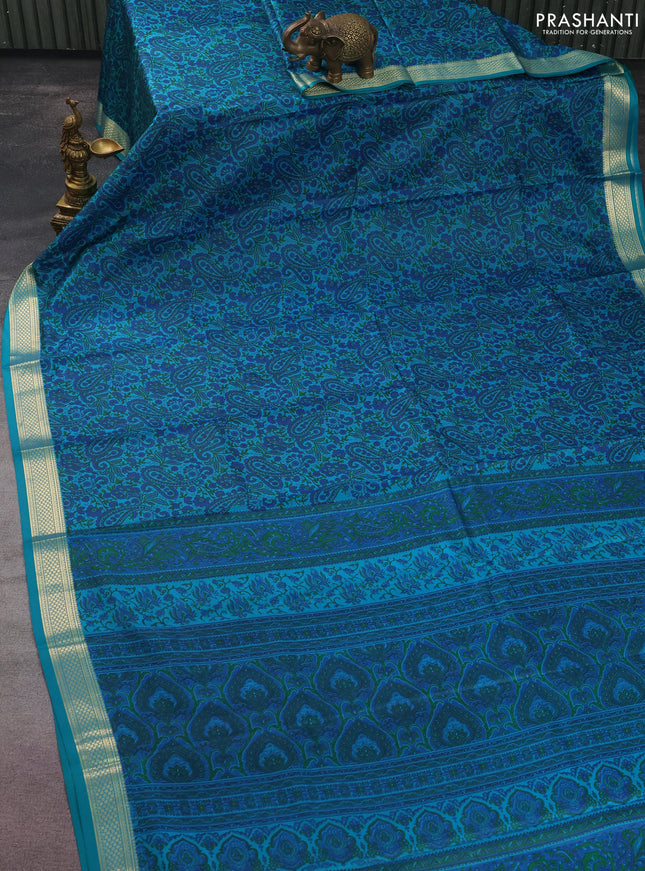 Printed silk saree teal green with allover prints and zari woven border