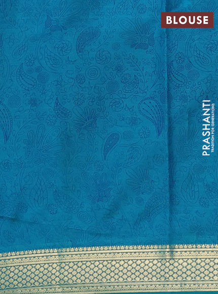 Printed silk saree teal green with allover prints and zari woven border