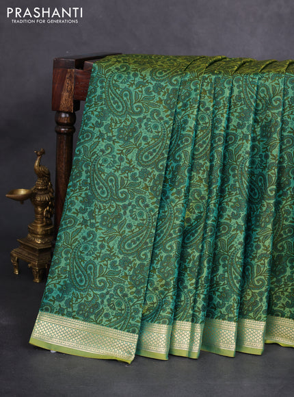 Printed silk saree dual shade of light green with allover prints and zari woven border
