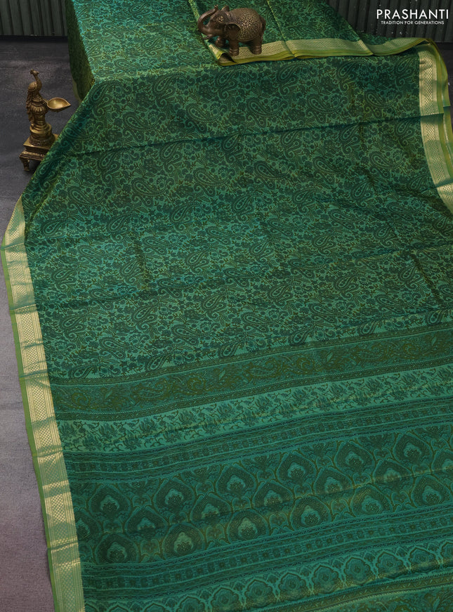 Printed silk saree dual shade of light green with allover prints and zari woven border