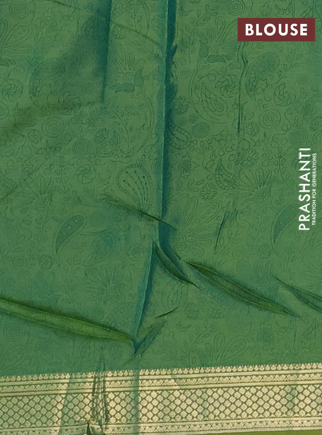 Printed silk saree dual shade of light green with allover prints and zari woven border