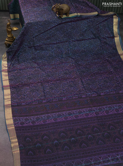 Printed silk saree dual shade of teal greenish purple with allover prints and zari woven border
