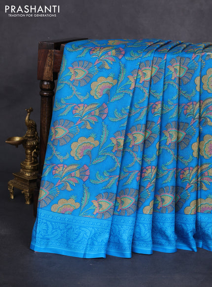 Printed silk saree csblue with allover prints and zari woven border