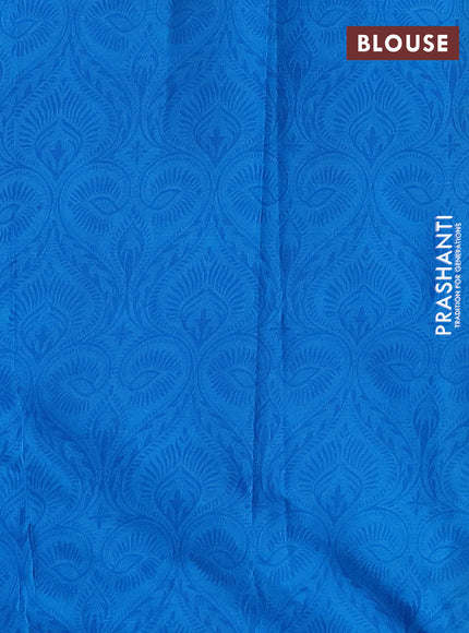 Printed silk saree csblue with allover prints and zari woven border