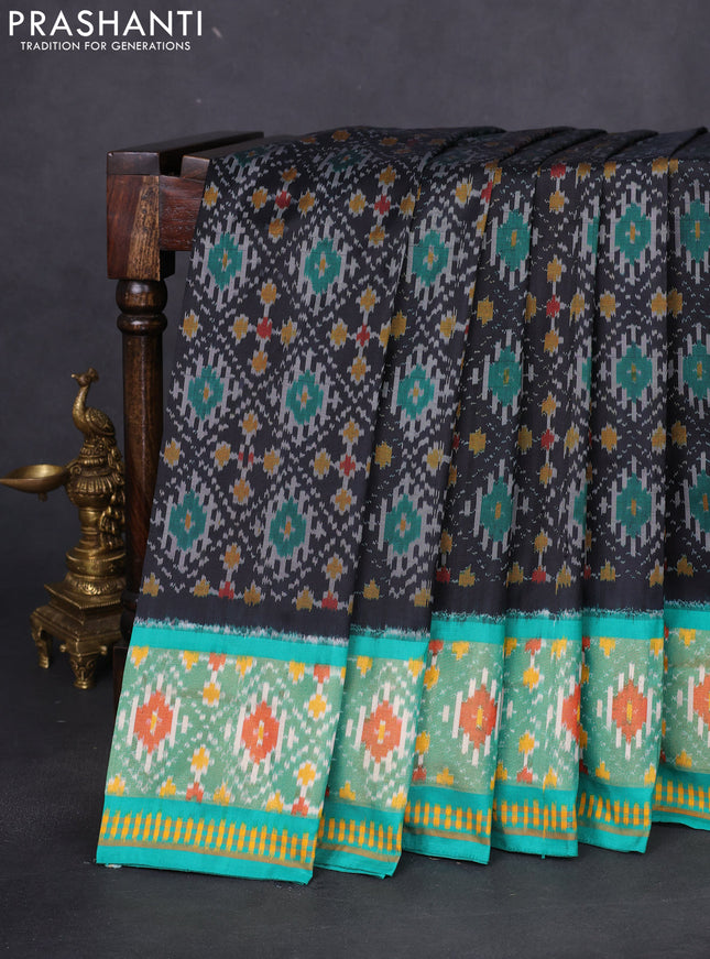 Pochampally silk saree black and teal green with allover ikat weaves and ikat woven zari border