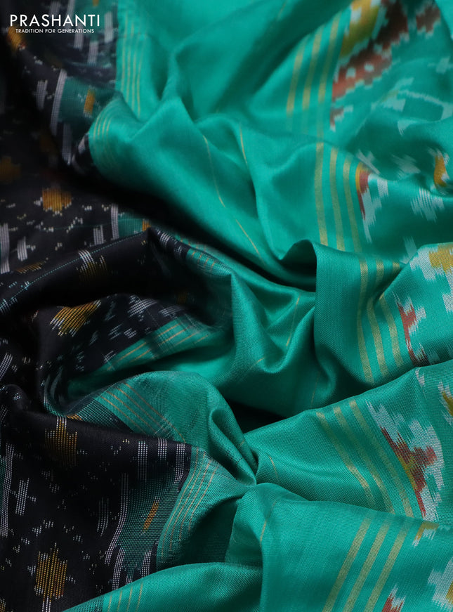 Pochampally silk saree black and teal green with allover ikat weaves and ikat woven zari border
