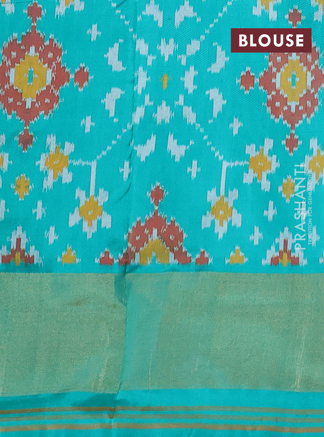 Pochampally silk saree black and teal green with allover ikat weaves and ikat woven zari border