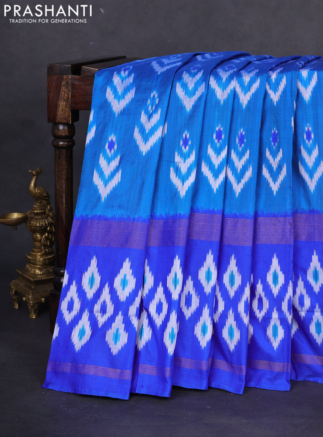 Pochampally silk saree cs blue and blue with allover ikat butta weaves and long zari woven ikat border