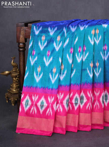 Pochampally silk saree dual shade of teal green and magenta pink with allover ikat butta weaves and long ikat woven zari border