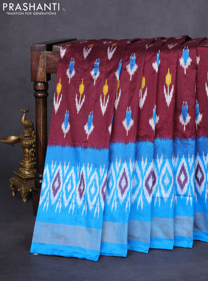 Pochampally silk saree deep maroon and cs blue with allover ikat butta weaves and long ikat woven zari border