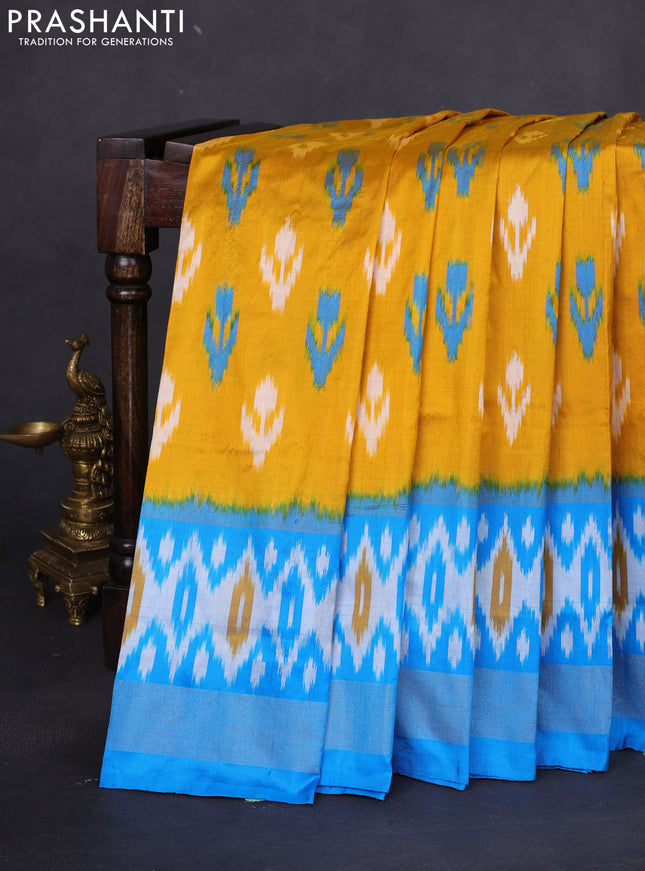 Pochampally silk saree mustard yellow and cs blue with allover ikat butta weaves and long ikat woven zari border