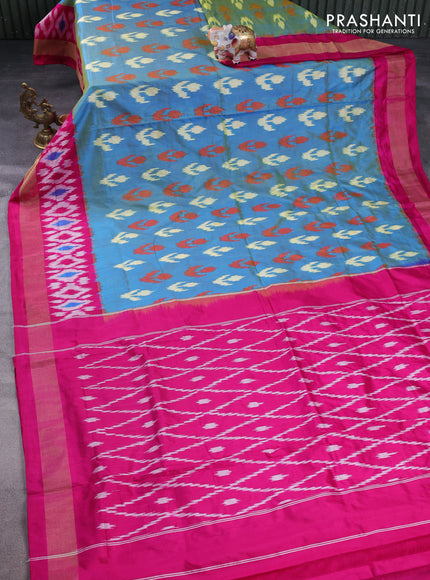 Pochampally silk saree dual shade of blue and magenta pink with allover ikat butta weaves and long ikat woven zari border