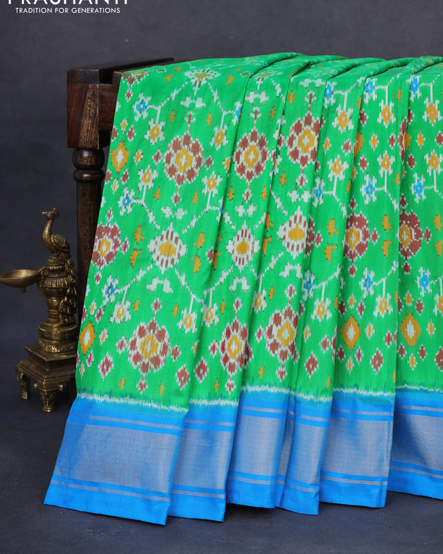 Pochampally silk saree green and cs blue with allover ikat weaves and zari woven border