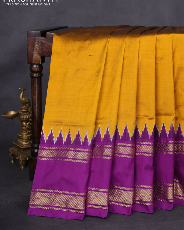 Pochampally silk saree dark mustard and purple with plain body and temple design rettapet zari woven border