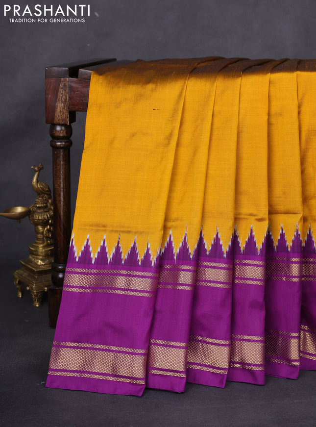 Pochampally silk saree dark mustard and purple with plain body and temple design rettapet zari woven border