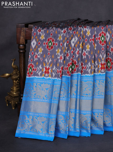 Pochampally silk saree grey and cs blue with allover ikat weaves and long silver & gold zari woven border