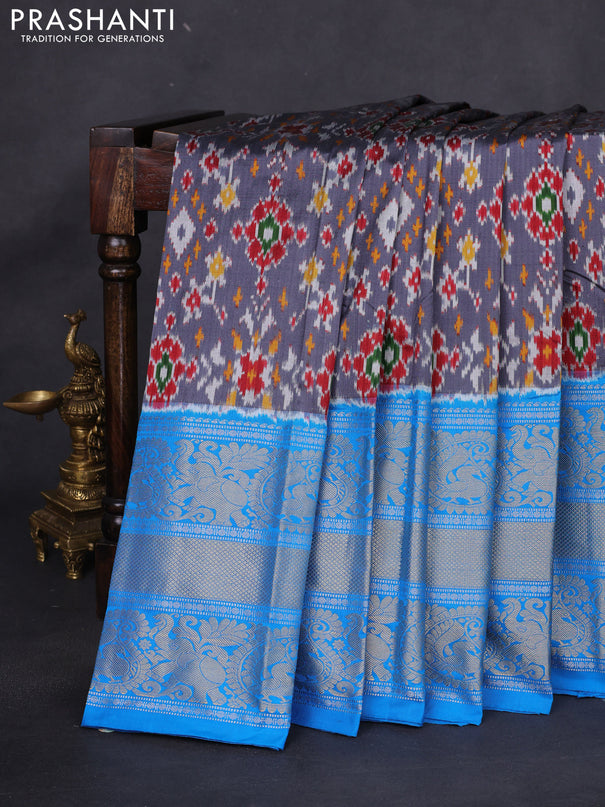 Pochampally silk saree grey and cs blue with allover ikat weaves and long silver & gold zari woven border