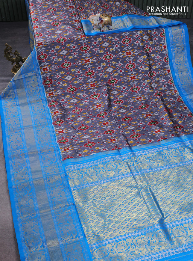 Pochampally silk saree grey and cs blue with allover ikat weaves and long silver & gold zari woven border