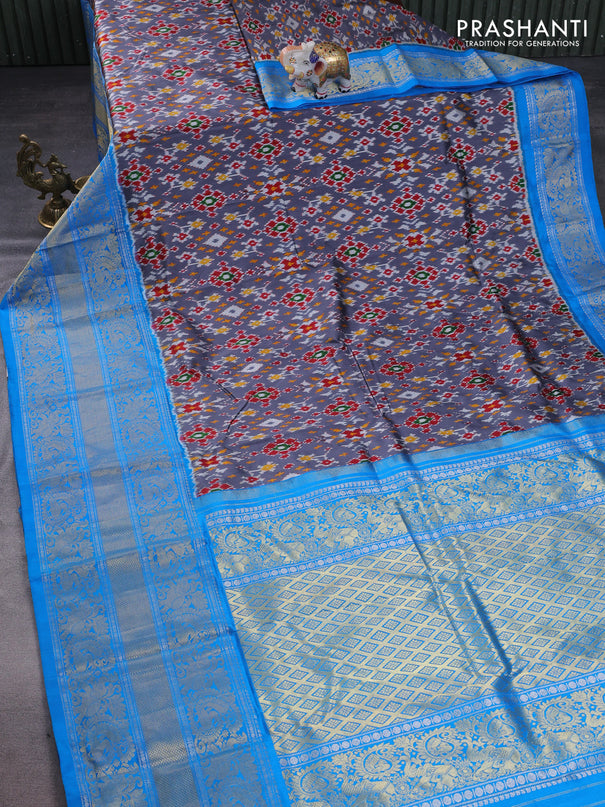 Pochampally silk saree grey and cs blue with allover ikat weaves and long silver & gold zari woven border