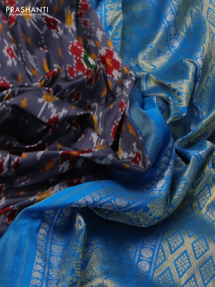 Pochampally silk saree grey and cs blue with allover ikat weaves and long silver & gold zari woven border