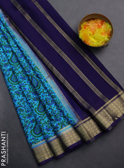 Semi mysore silk saree light blue and navy blue with allover prints and zari woven border