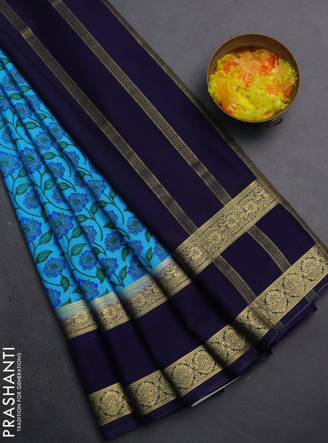 Semi mysore silk saree light blue and navy blue with allover floral prints and rettapet zari woven border