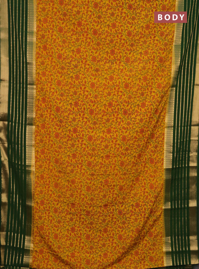 Semi mysore silk saree yellow and green with allover kalamkari prints and long zari woven border