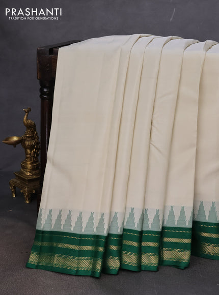Pure kanchipuram silk saree off white and green with plain body and temple design zari woven border
