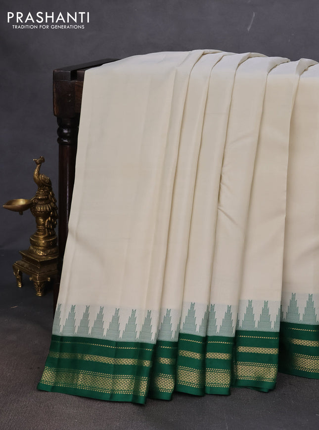 Pure kanchipuram silk saree off white and green with plain body and temple design zari woven border