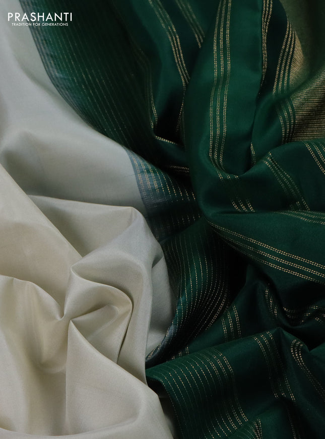 Pure kanchipuram silk saree off white and green with plain body and temple design zari woven border