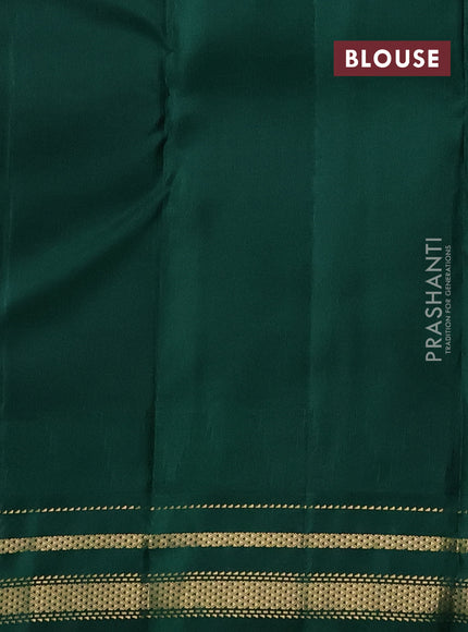 Pure kanchipuram silk saree off white and green with plain body and temple design zari woven border