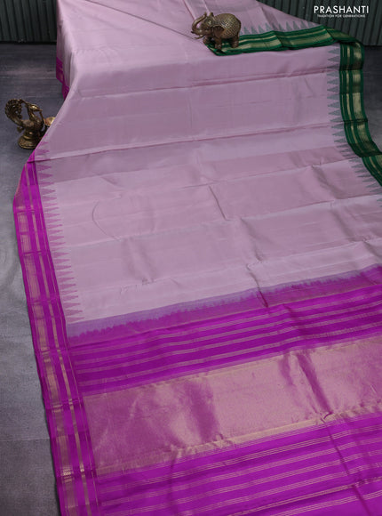 Pure kanchipuram silk saree pastel pink shade with plain body and ganga jamuna border