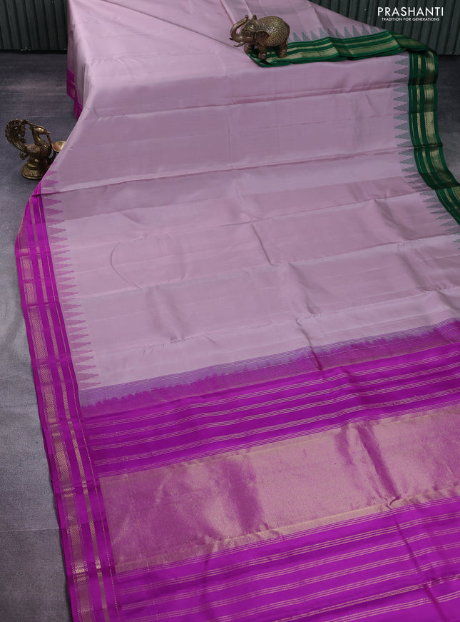 Pure kanchipuram silk saree pastel pink shade with plain body and ganga jamuna border