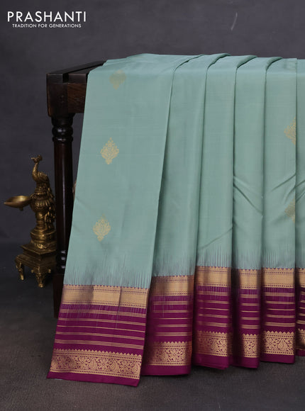 Pure kanchipuram silk saree pastel blue and deep purple with zari woven buttas and rich zari woven border