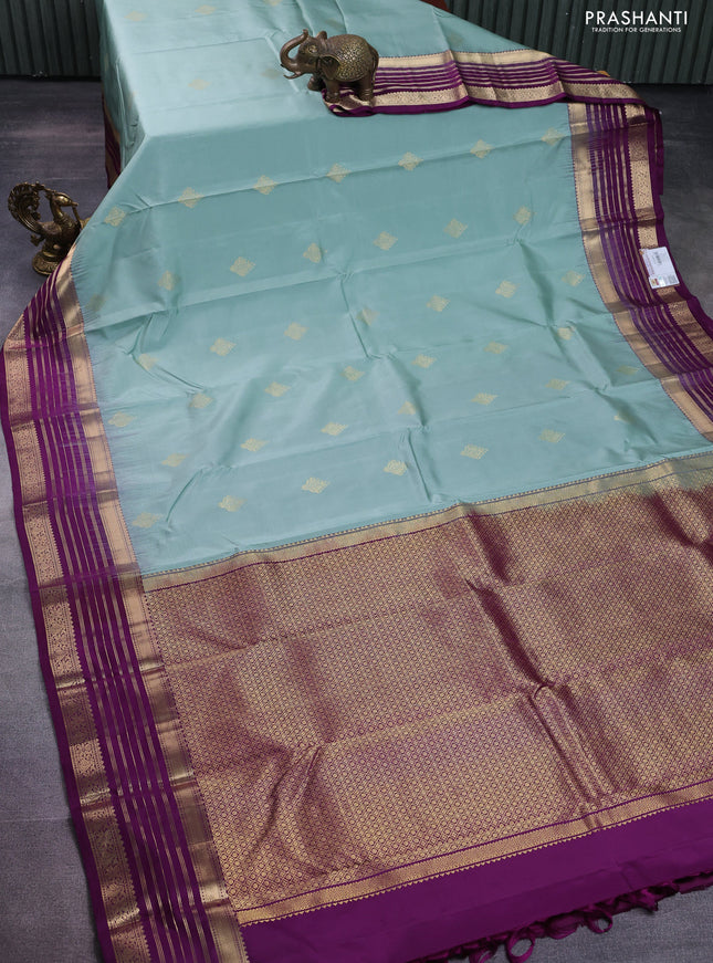 Pure kanchipuram silk saree pastel blue and deep purple with zari woven buttas and rich zari woven border