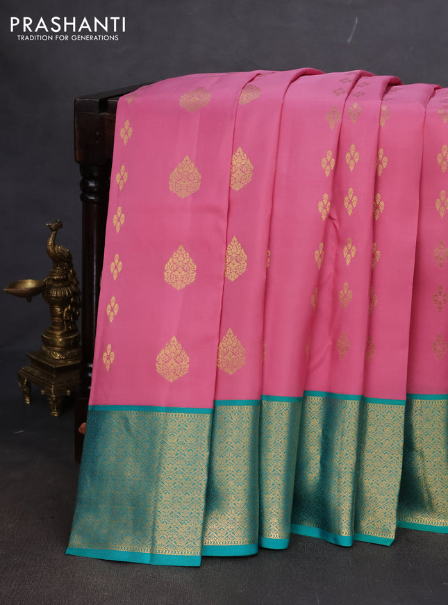 Pure kanchipuram silk saree peach pink and teal green shade with zari woven buttas and zari woven korvai buttas